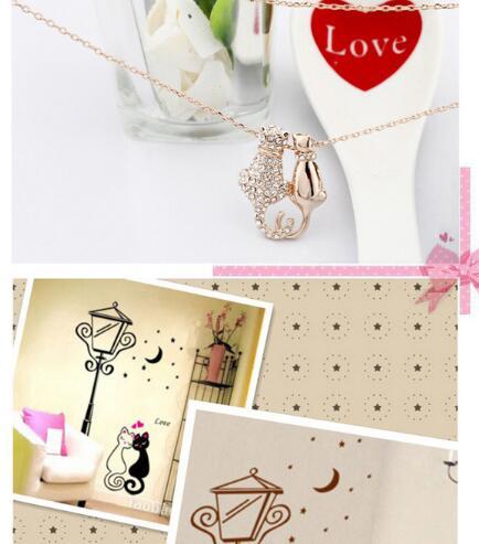 Collage of a necklace with a cat pendant, a heart-shaped card, and decorative lanterns on a starry background.