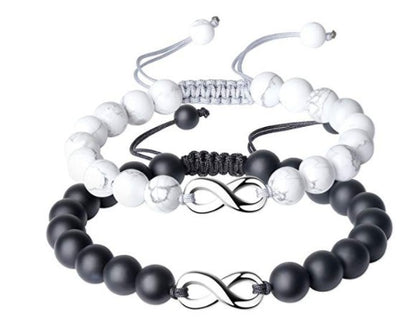 Set of three beaded bracelets with infinity symbols on a white background