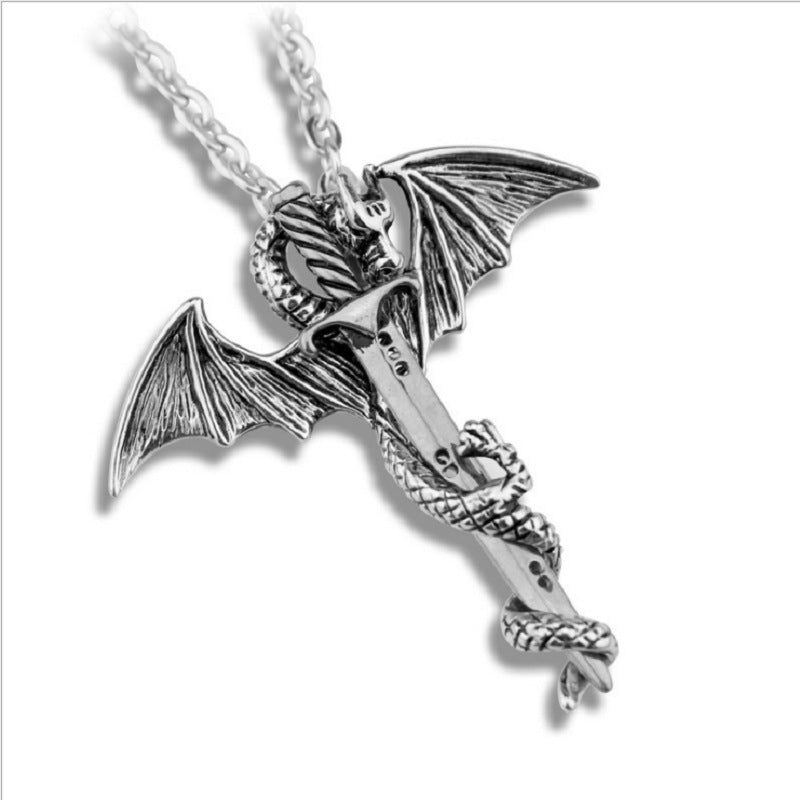 Silver dragon pendant necklace on a white background