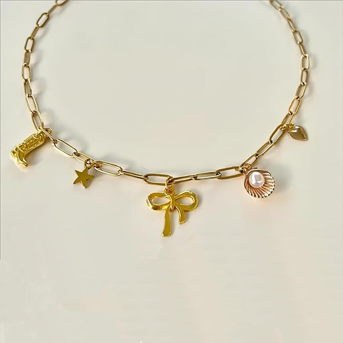 Gold Clip Necklace with Bow & Five-Pointed Star