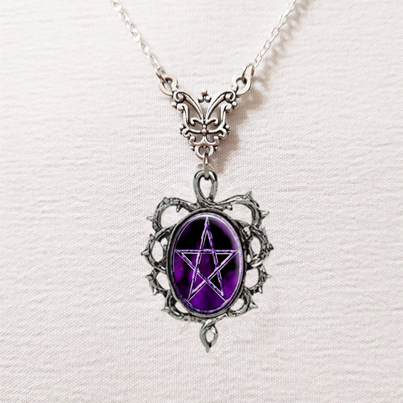Necklace with a purple pentagram pendant on a white background